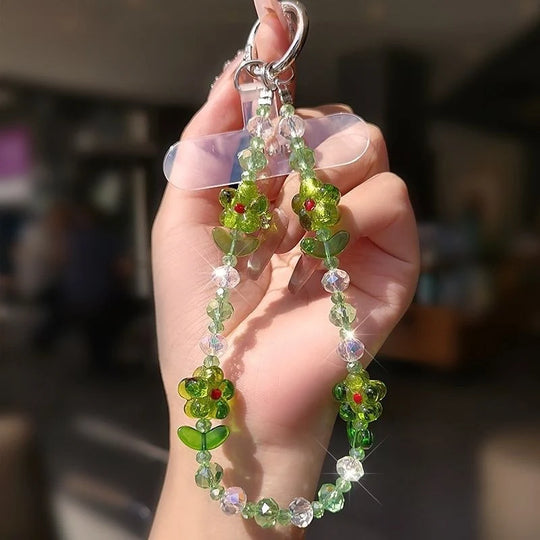 Accessoire de téléphone avec lanière à perles et motif floral 7