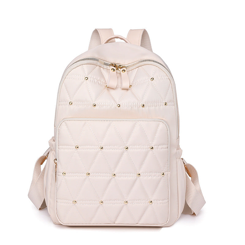 Sac à dos matelassé pour femme avec détails métalliques 1