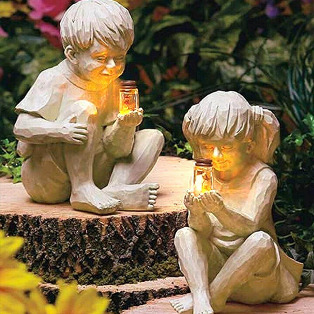 Enfants avec lucioles solaires Statues de jardin